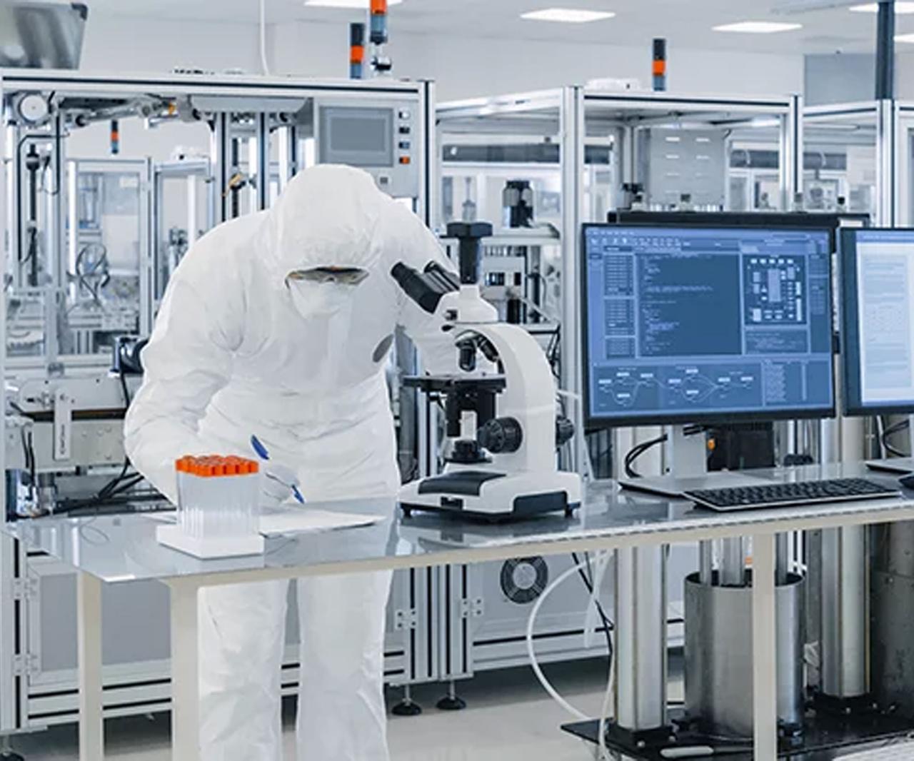 Pharmaceutical quality control laboratory work with microscope and sample tubes